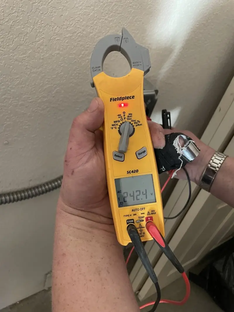 Voltage testing with clamp meter during Electrical Installation Services in Eagan